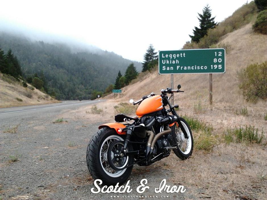 harley davidson cafe racer style clip on bars shorty exhaust orange paint scotch and iron