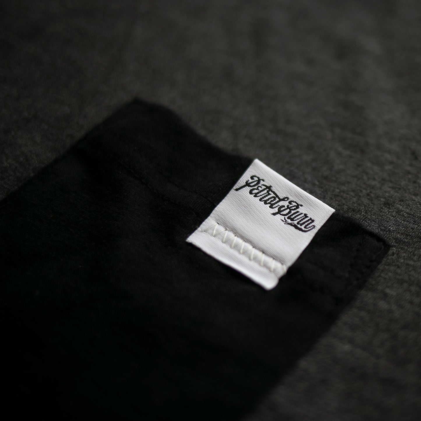 petrol burn pocket tee logo label