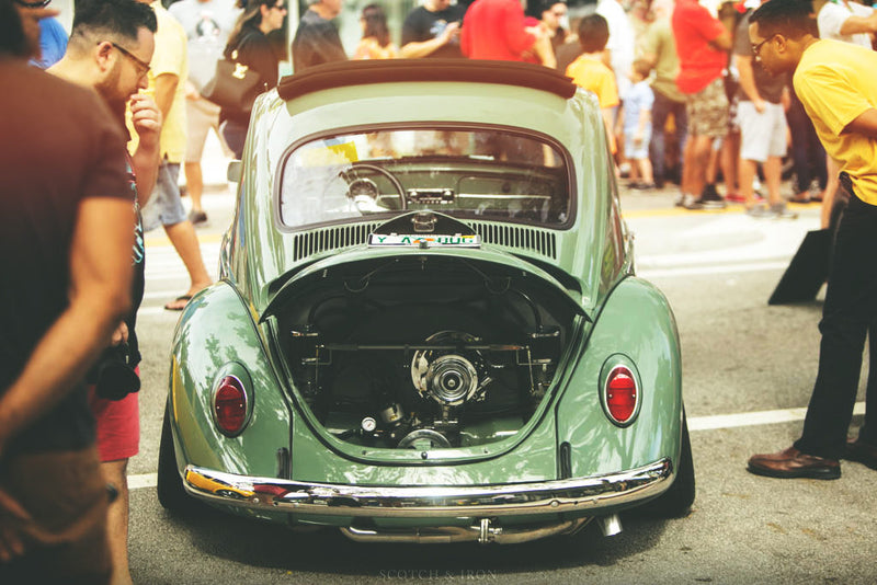 People looking at car