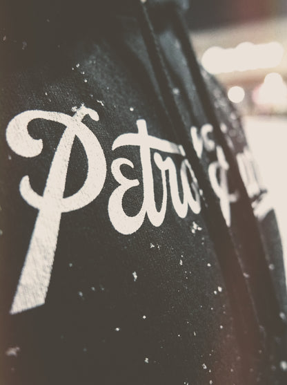 Close-up of a hoodie with petrol burn whote logo