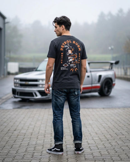 male model wearing a petrol burn mens thirt with a spark plug logo