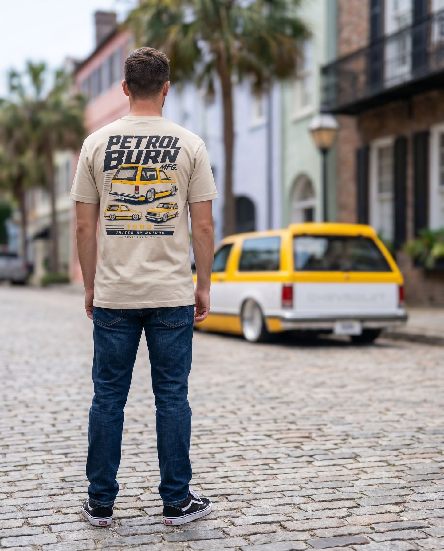 man wearing a petrol burn tshirt with a bagged chevy blazer