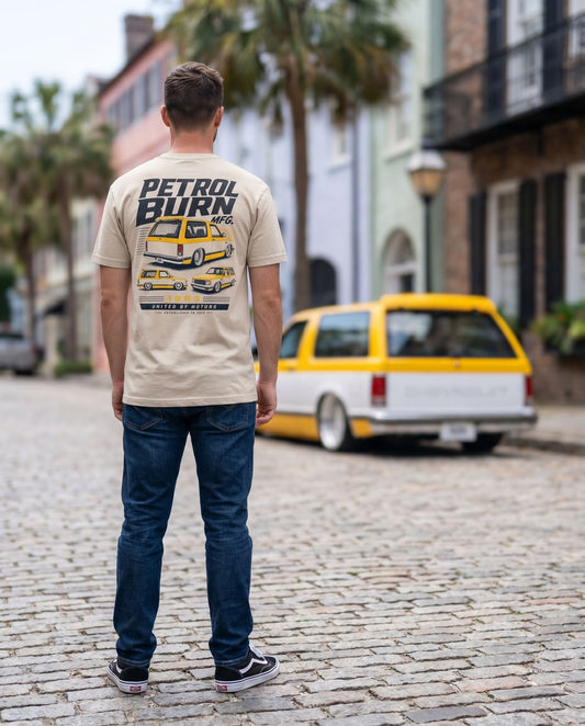 man wearing a petrol burn tshirt with a bagged chevy blazer